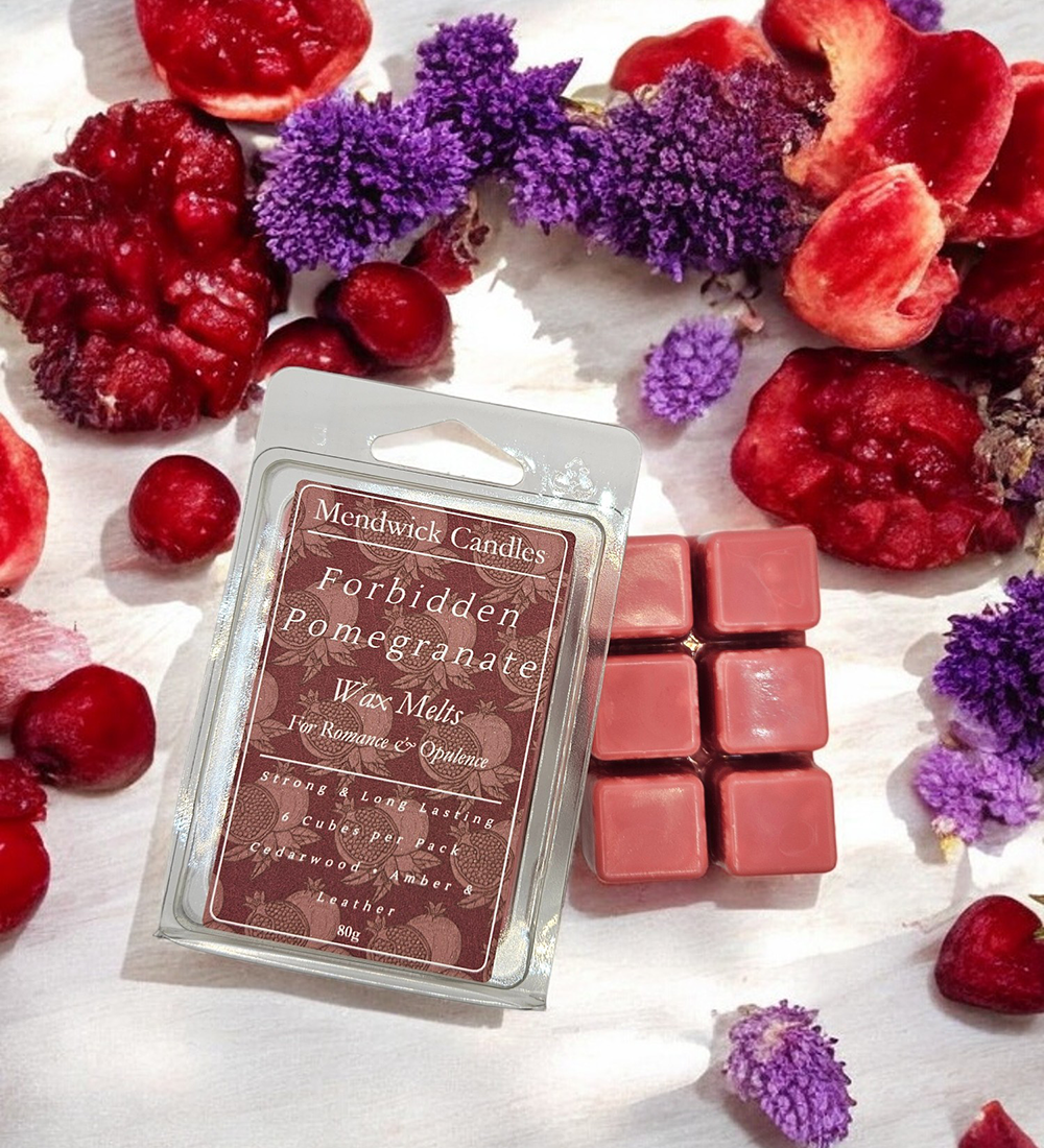 Forbidden Pomegranate Scented Wax Melt lifestyle shot with plum, lavender and pomegranates 