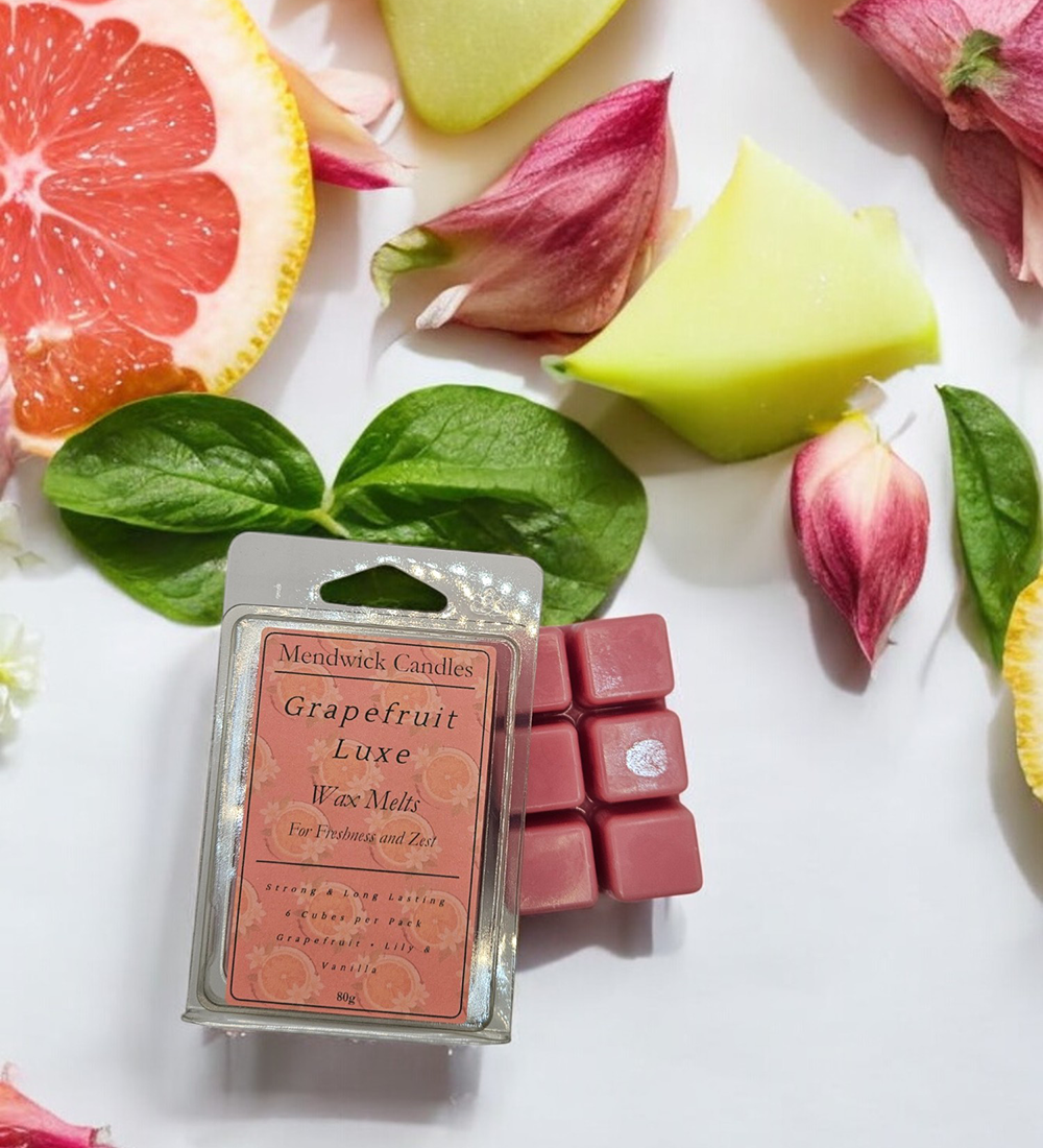 Grapefruit Luxe Wax Melts - Shown with grapefruit pieces, basil and petals