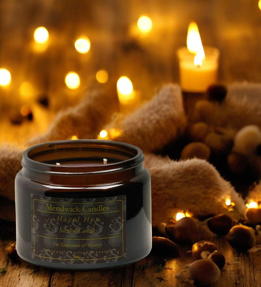 Hazel Hex Scented candle in a warm shot surrounded by a blanket and soft glowing candles