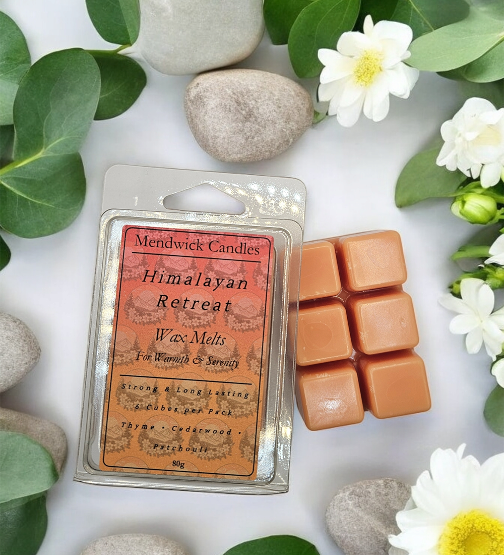 Himalayan Retreat Wax Melt Lifestyle shot showing eucalyptus, smooth rock and white flowers