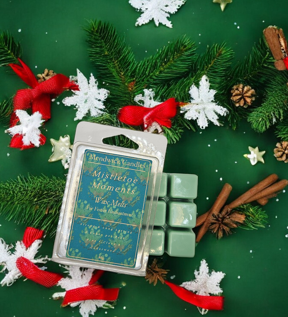 Mistletoe Moments Wax Melts - Shown with snow flakes, pine needles and cinnamon sticks on a deep green background