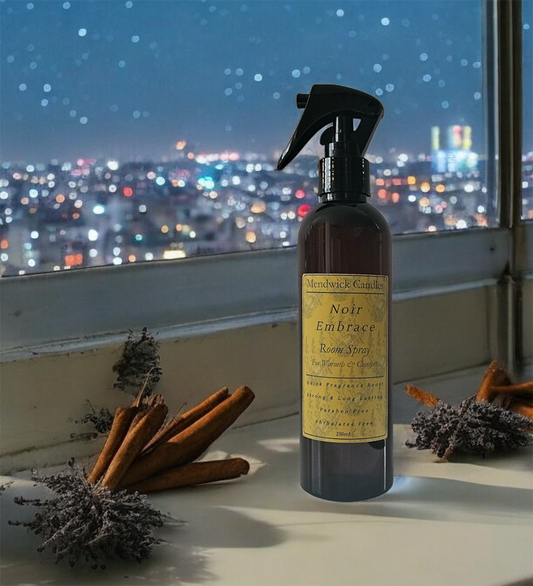 Noir Embrace Room Spray Shown with a city backdrop with lavender and cinnamon