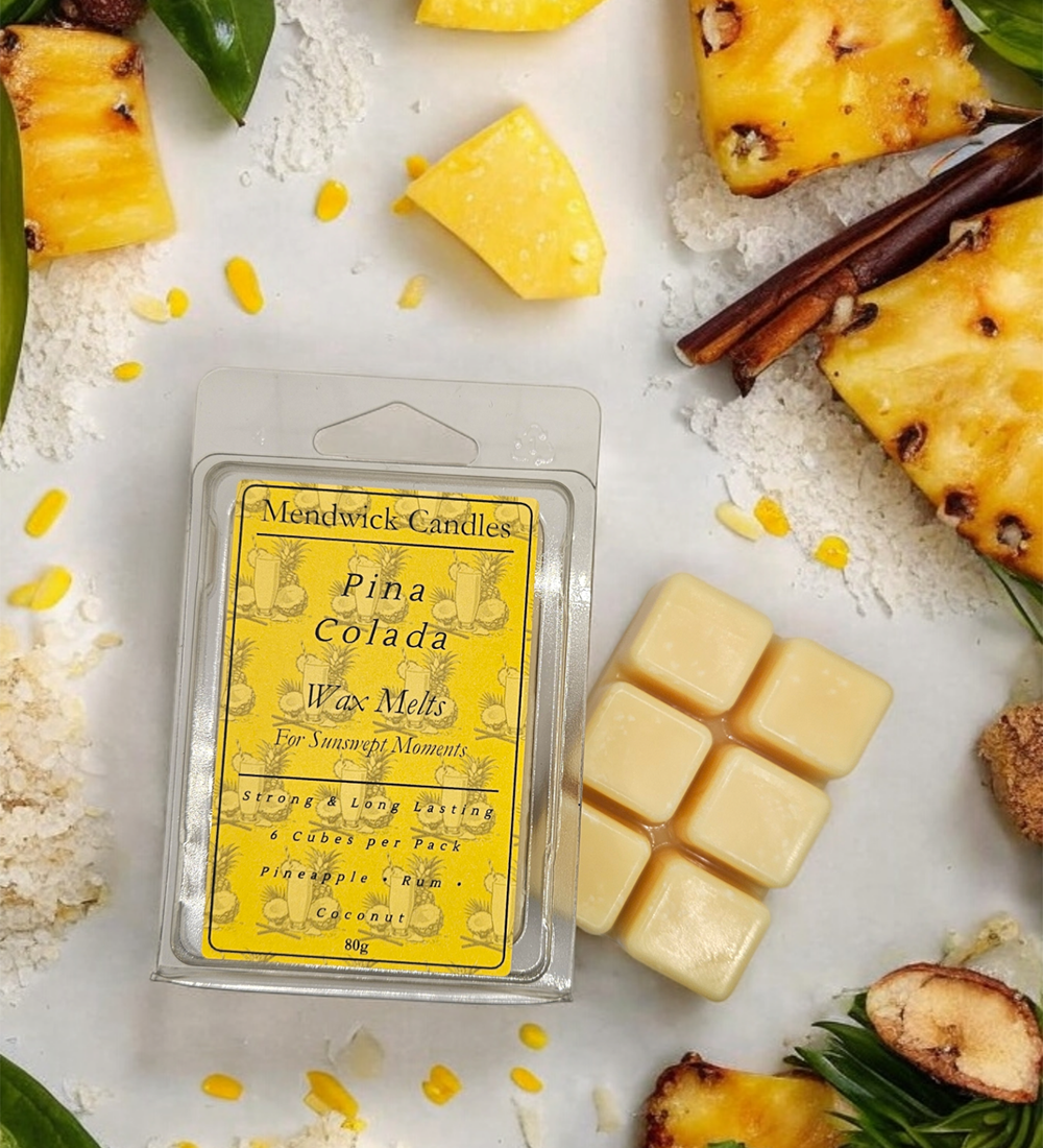 Pina Colada wax melts shown surrounded by pineapple and coconut shavings