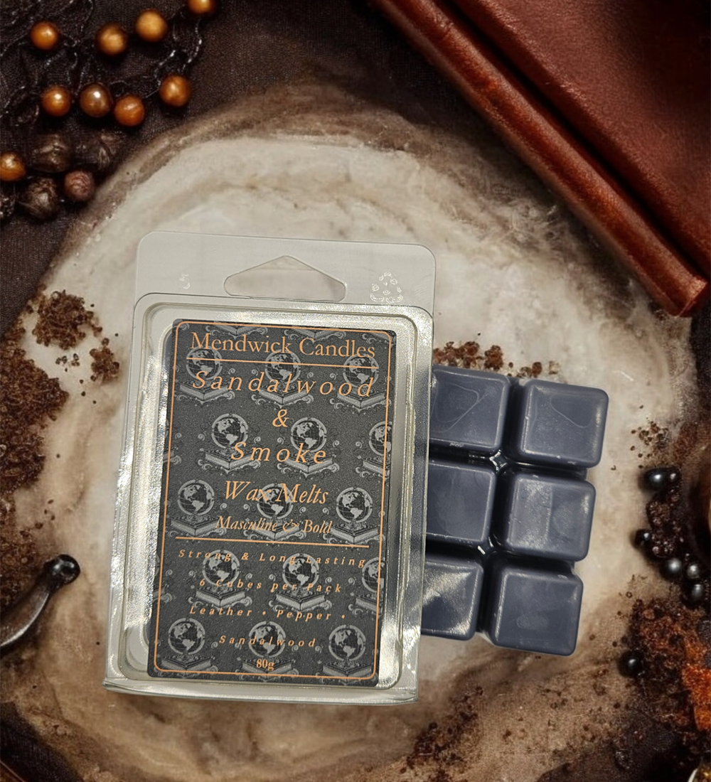 Sandalwood & Smoke Wax Melts shown on a wooden board surrounded by leather and peppercorns