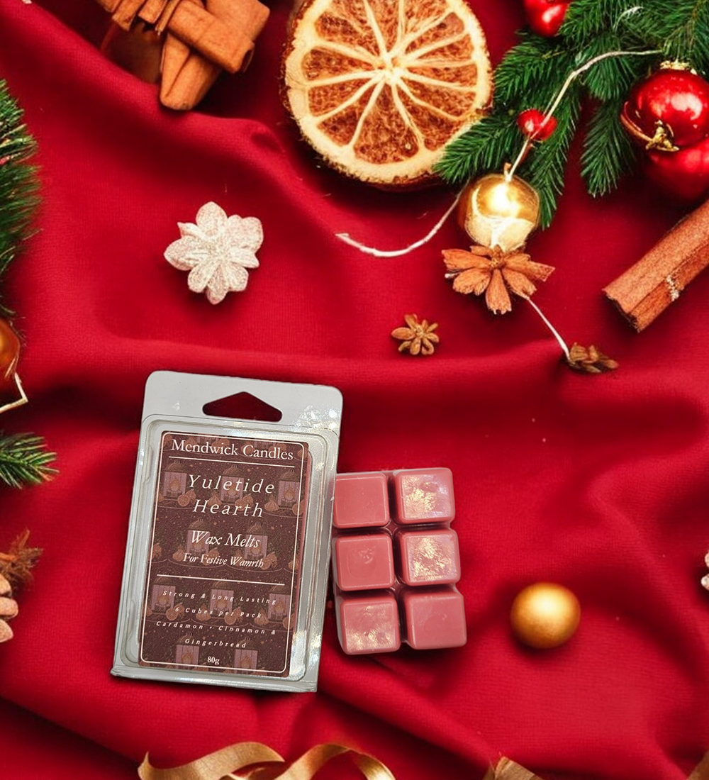 Yuletide Hearth Wax Melts - Shown on a red background with oranges slices, spices and festive decorations